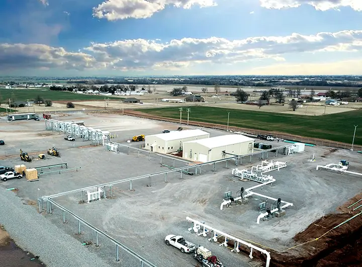A crude terminal facility with piping and buildings, seen from the air