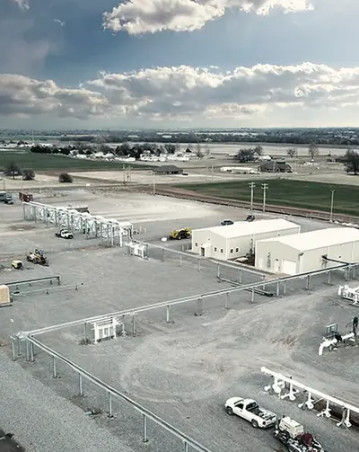 A crude terminal facility with piping and buildings, seen from the air